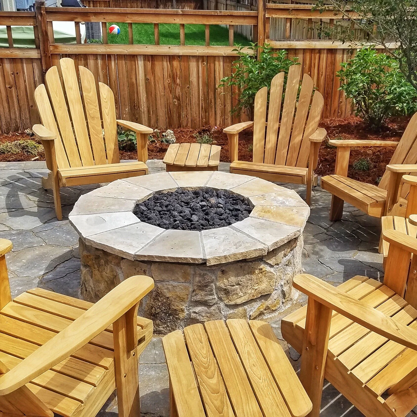 natural stone fire pit with seating