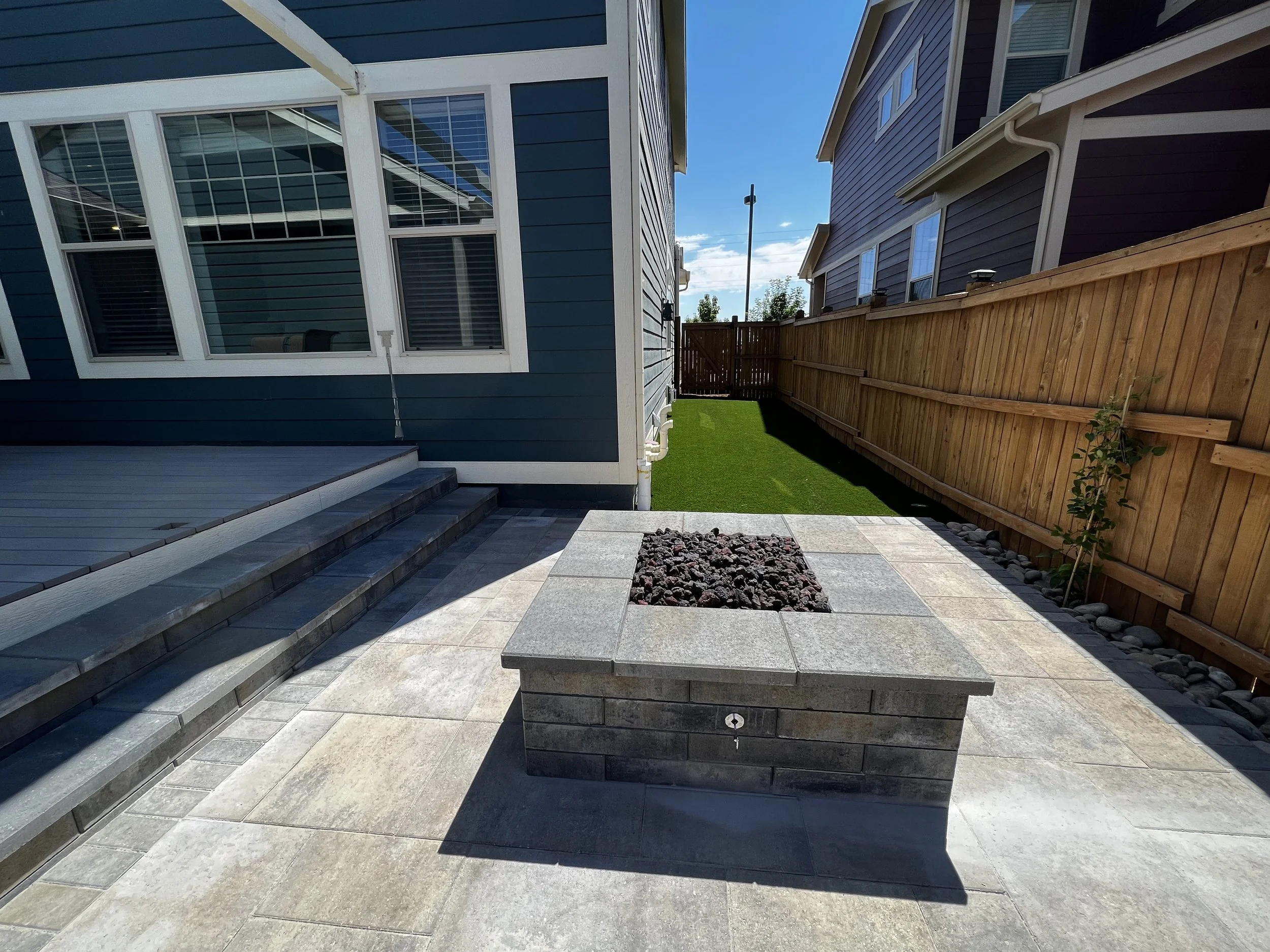 custom paver patio with fire pit