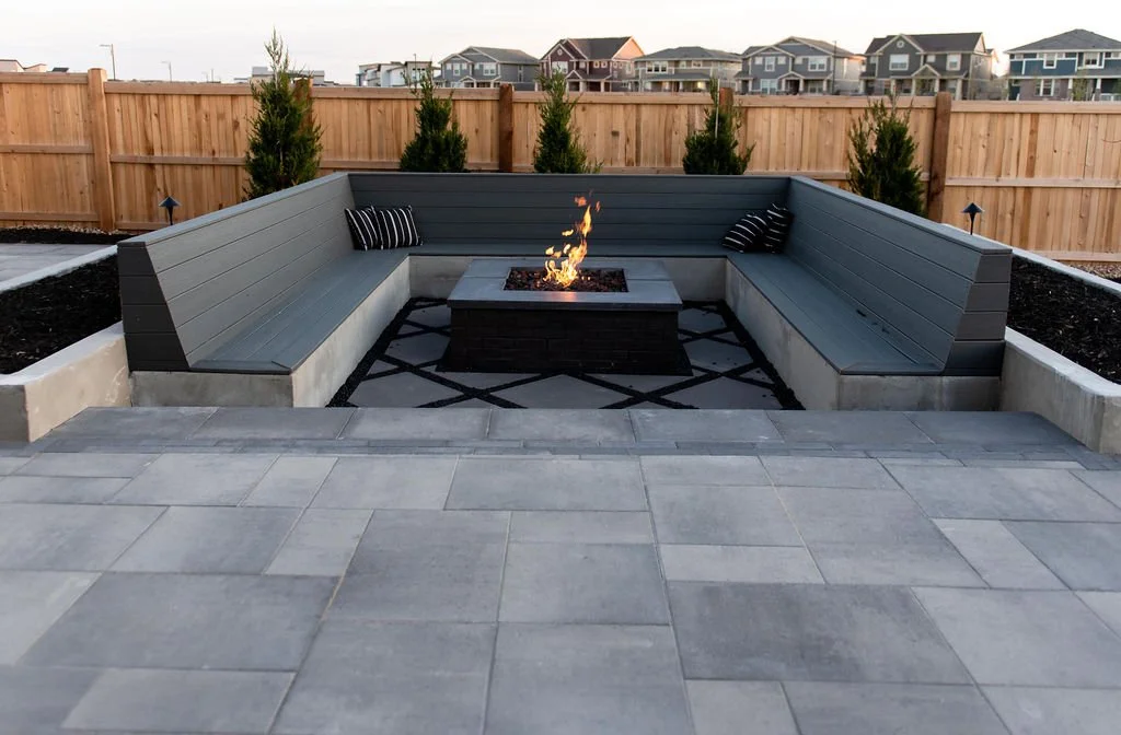 large square seating area around stone fire pit