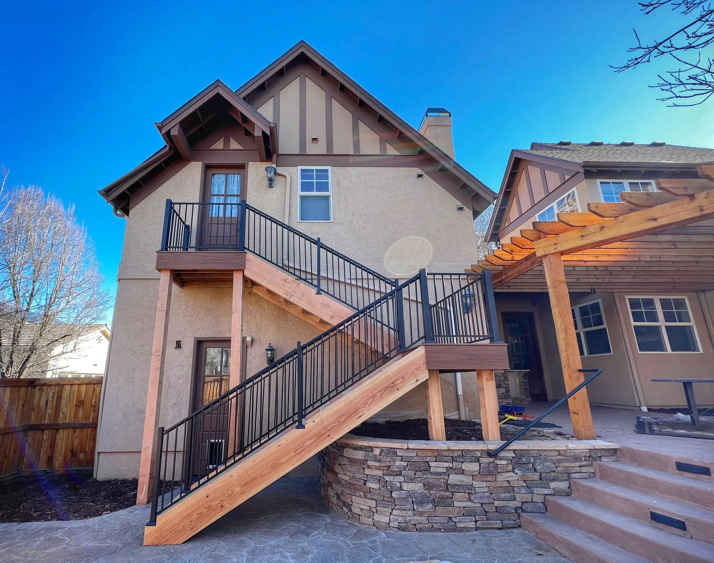 wood staircase with black railing