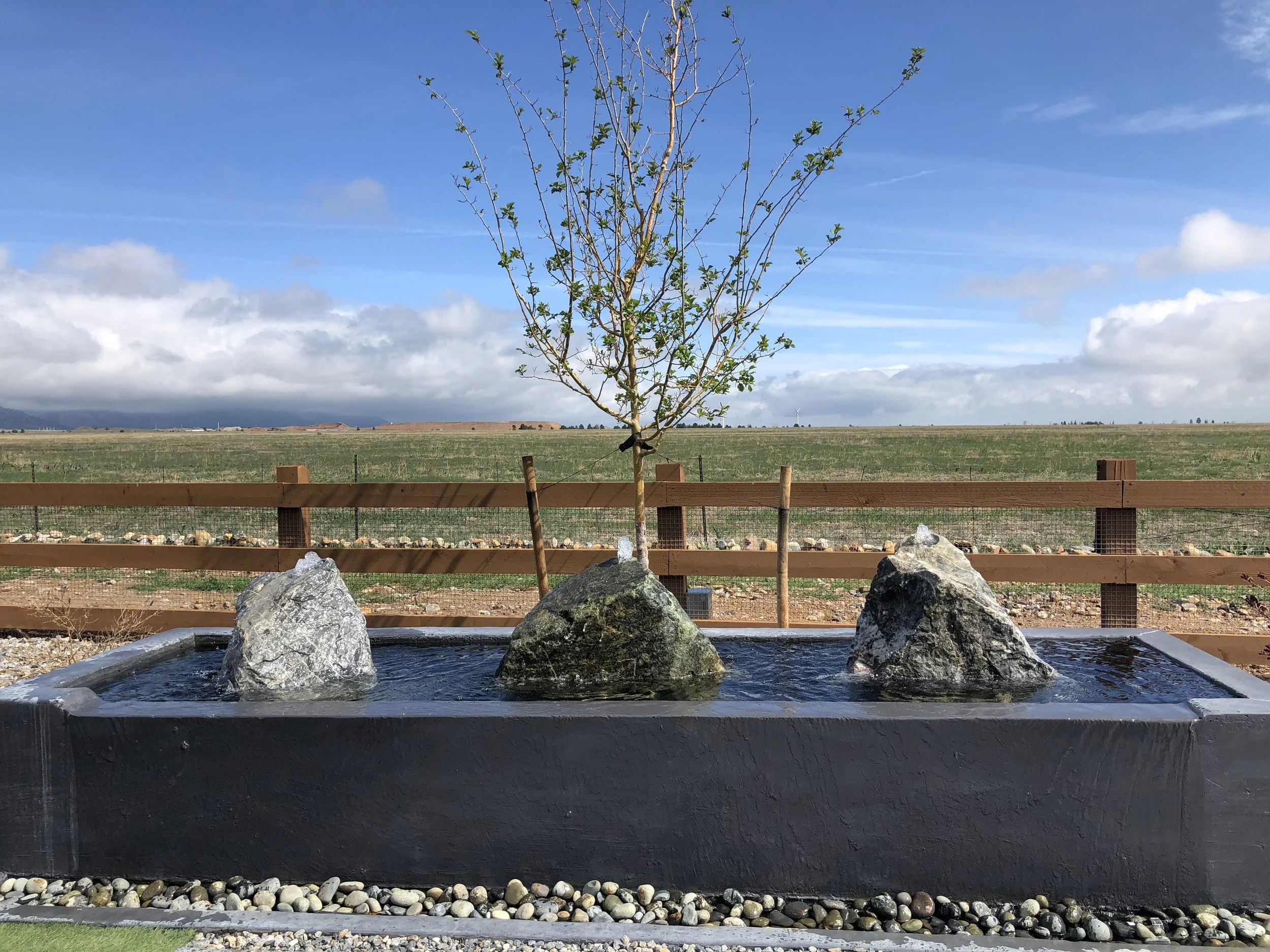 custom stone water feature with boulders
