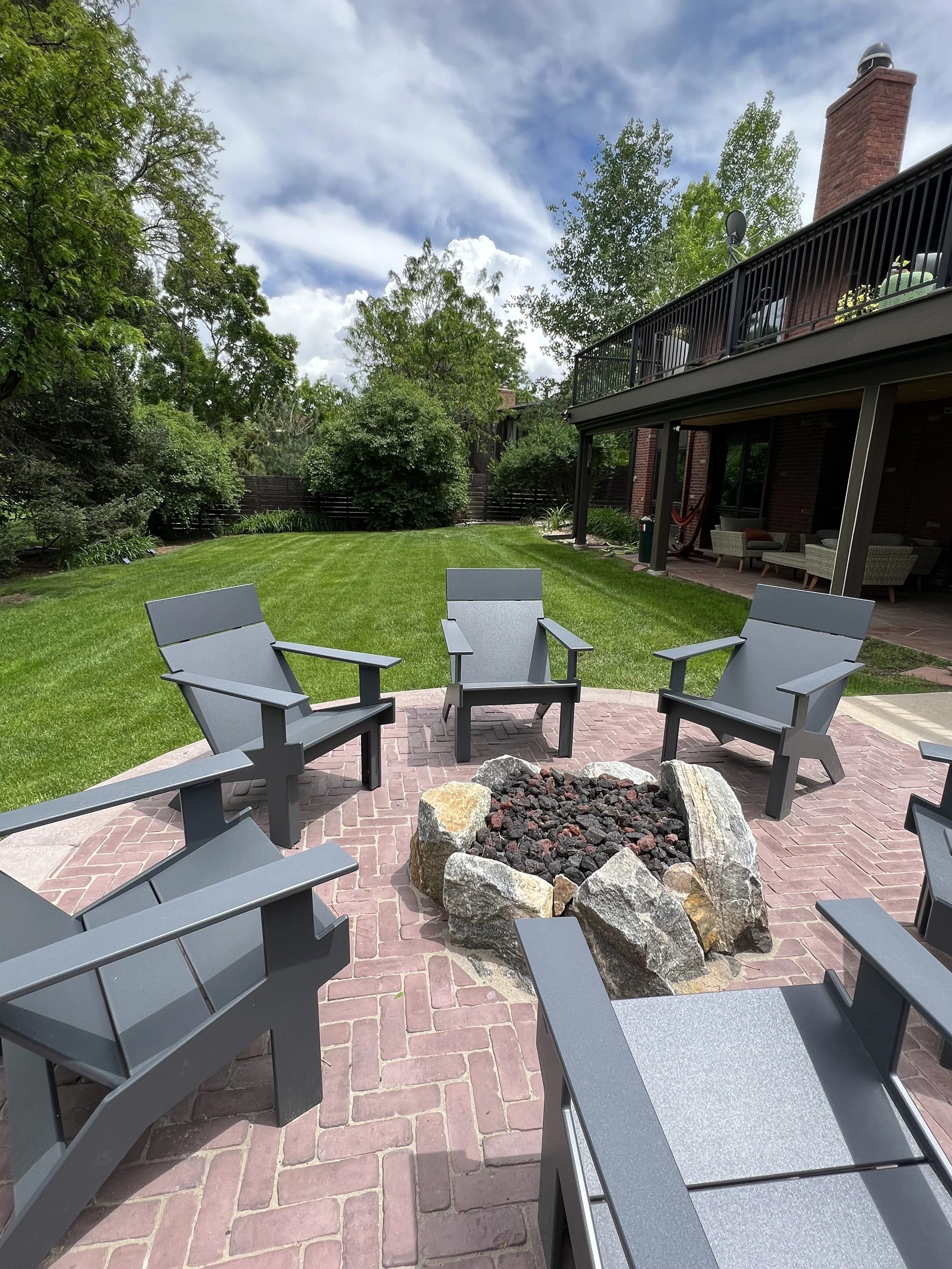 natural boulder fire pit brick patio