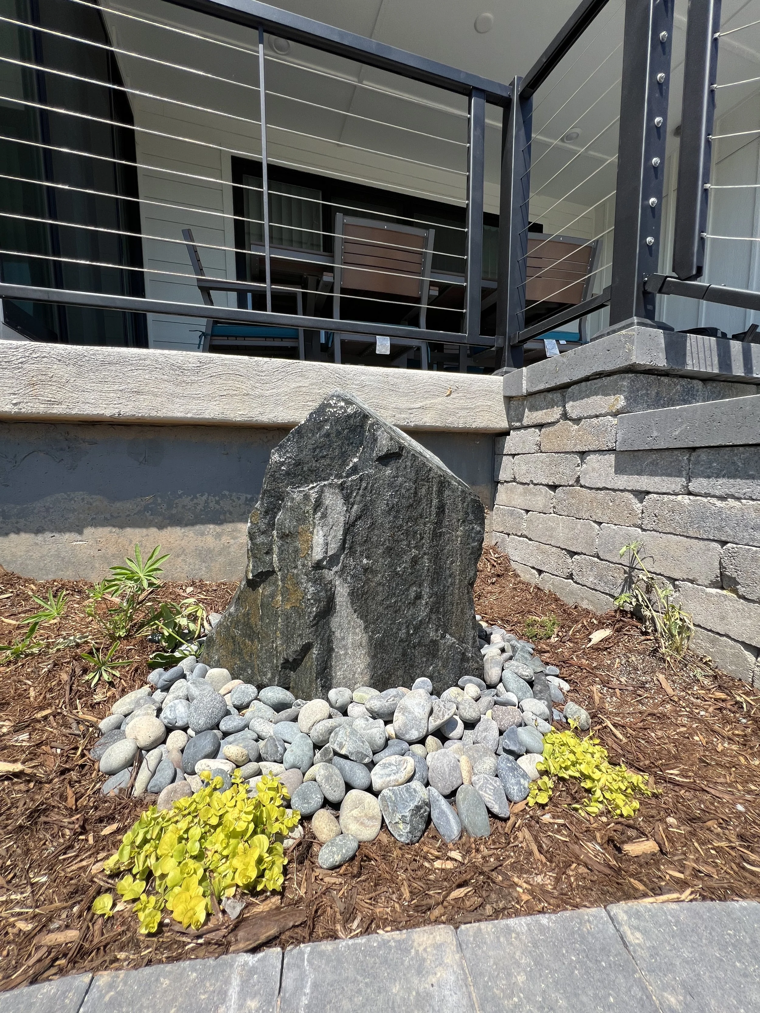 custom stone water feature in garden