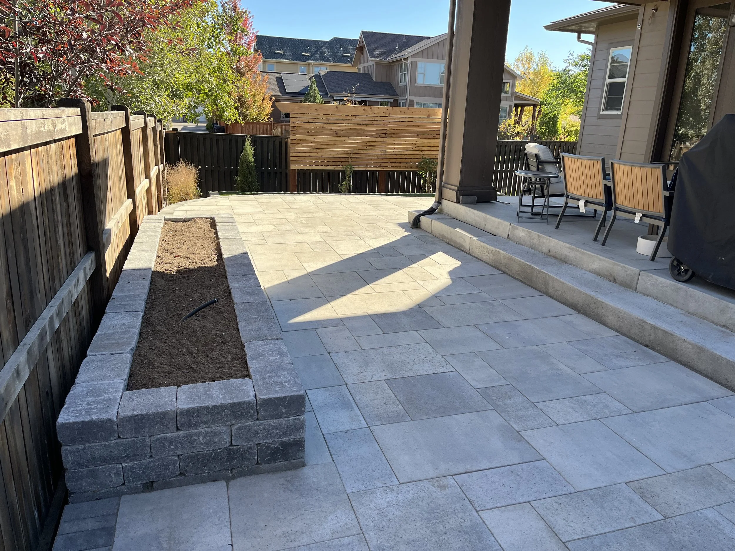 custom paver patio with paver garden box