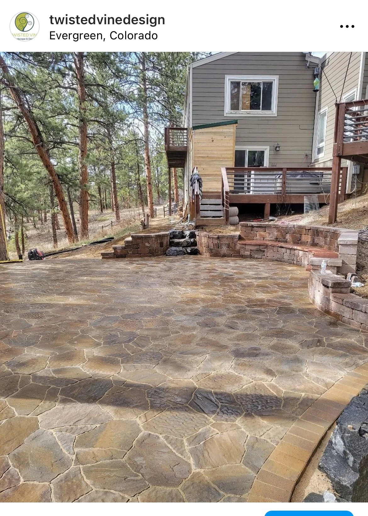 beautiful large custom stone patio and seating