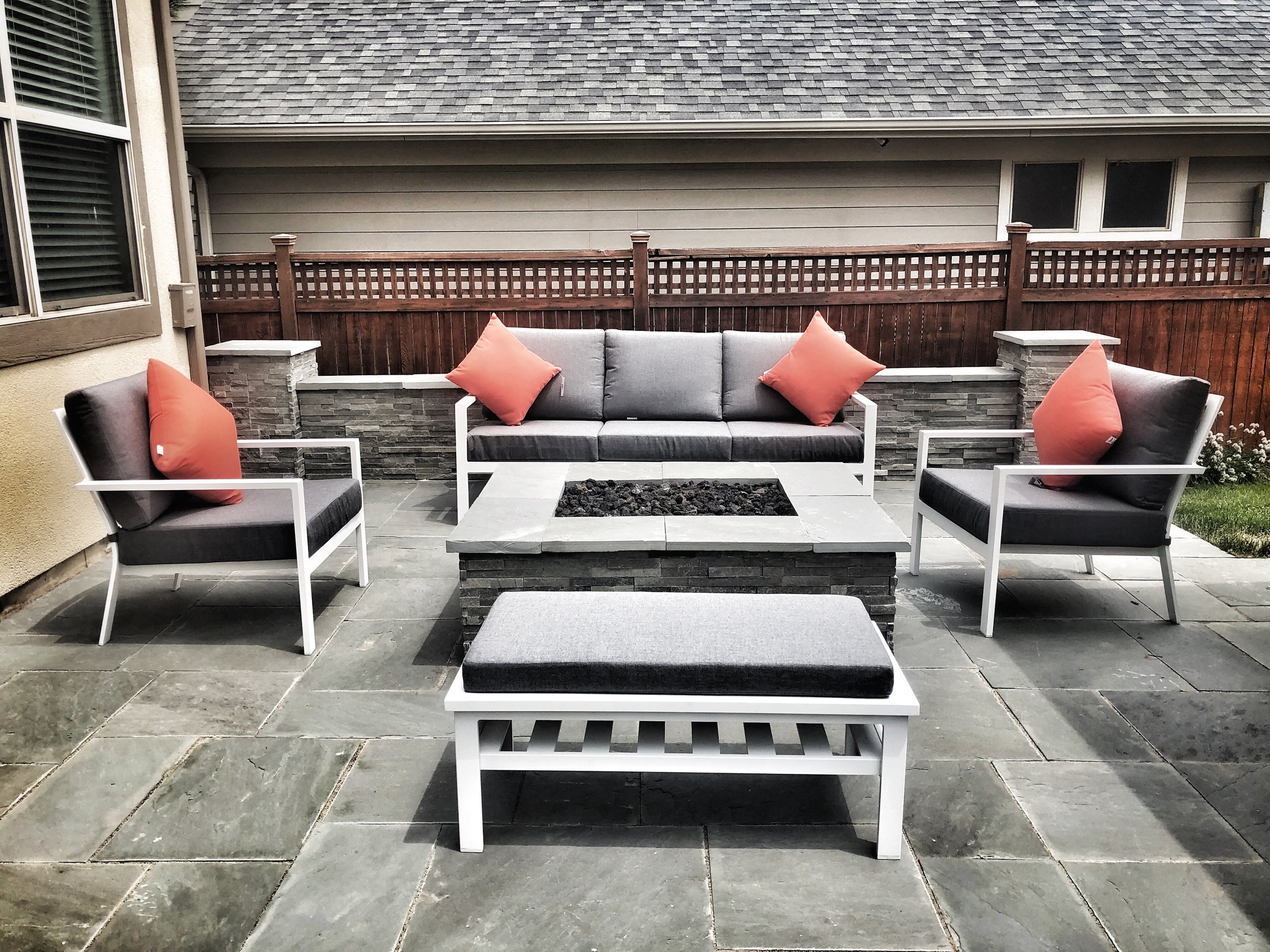 rectangular stone outdoor fire pit with seating