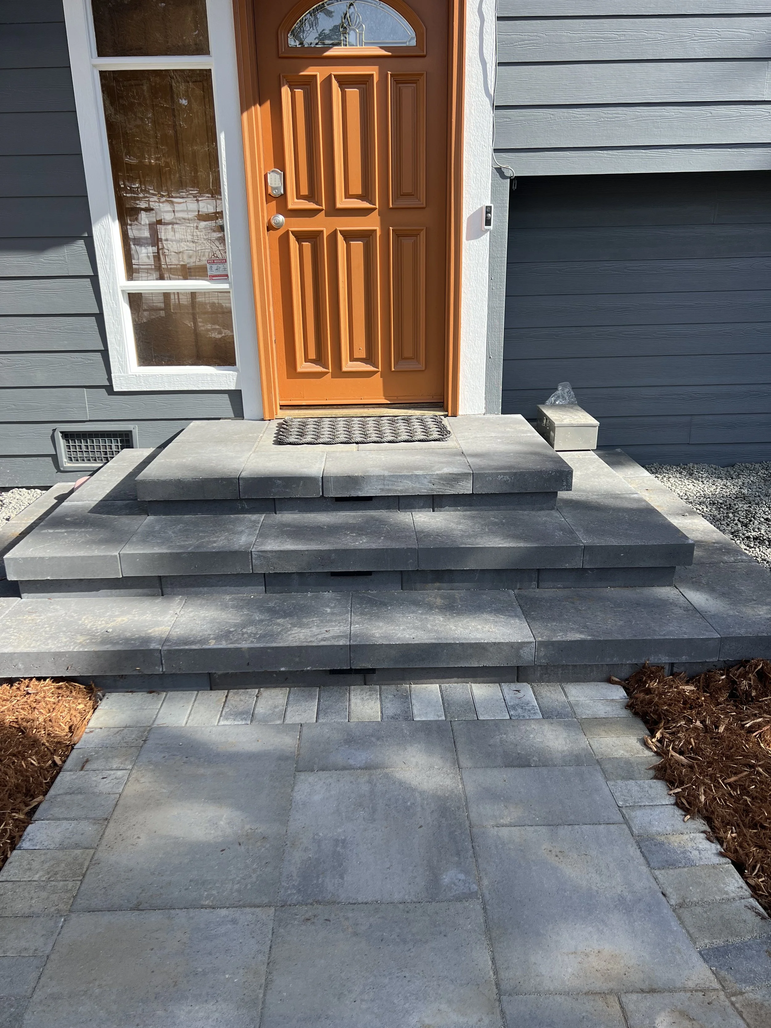custom paver staircase and walkway surrounded by garden