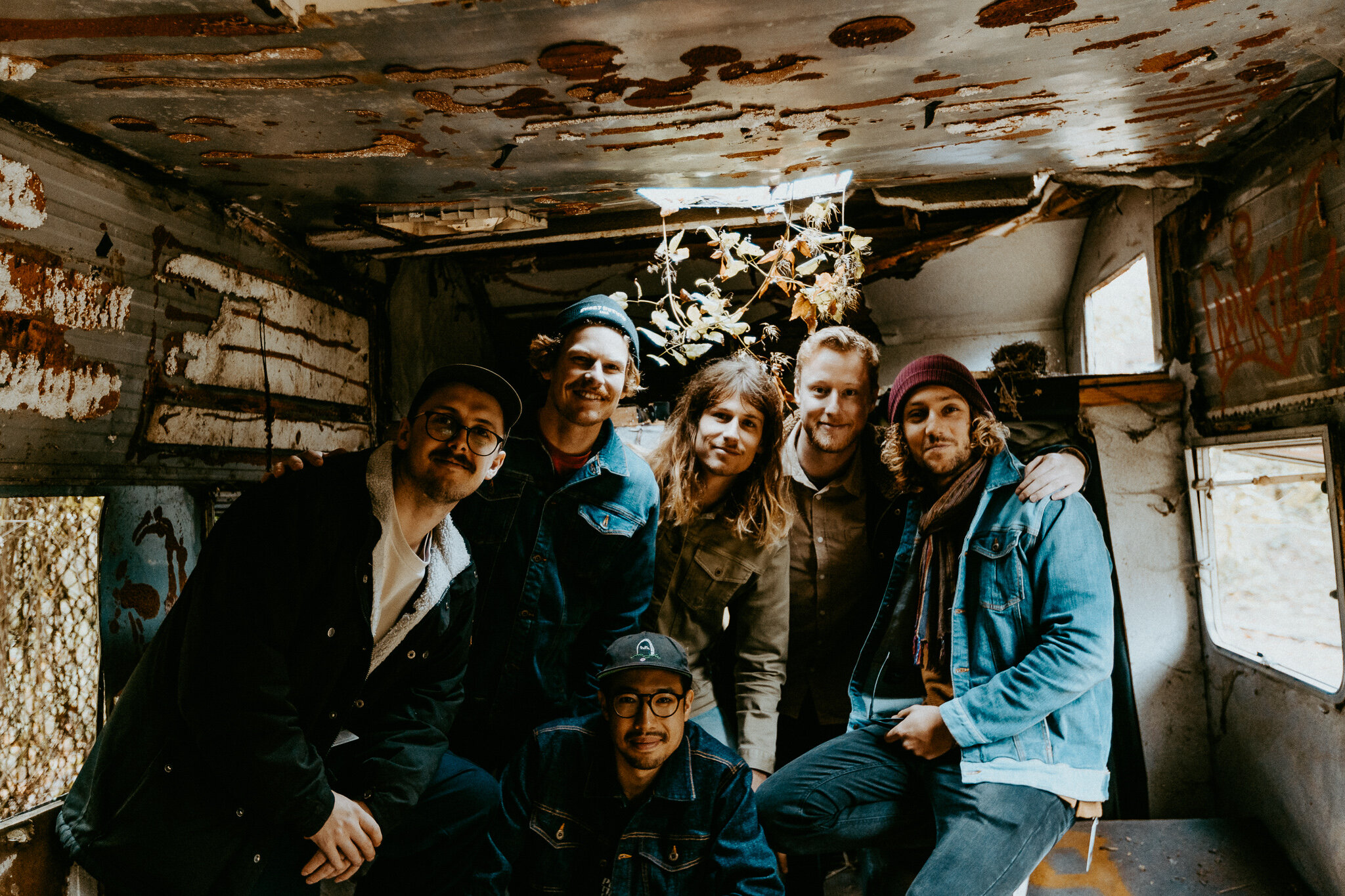 The crew inside an old abandoned bus in Teufelsberg. 
