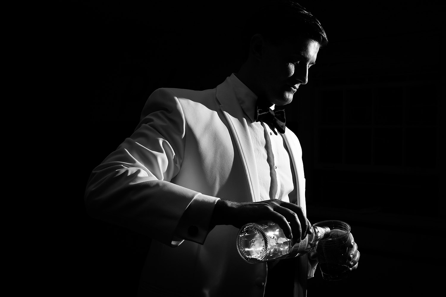 040groom-pouring-alcohol.jpg