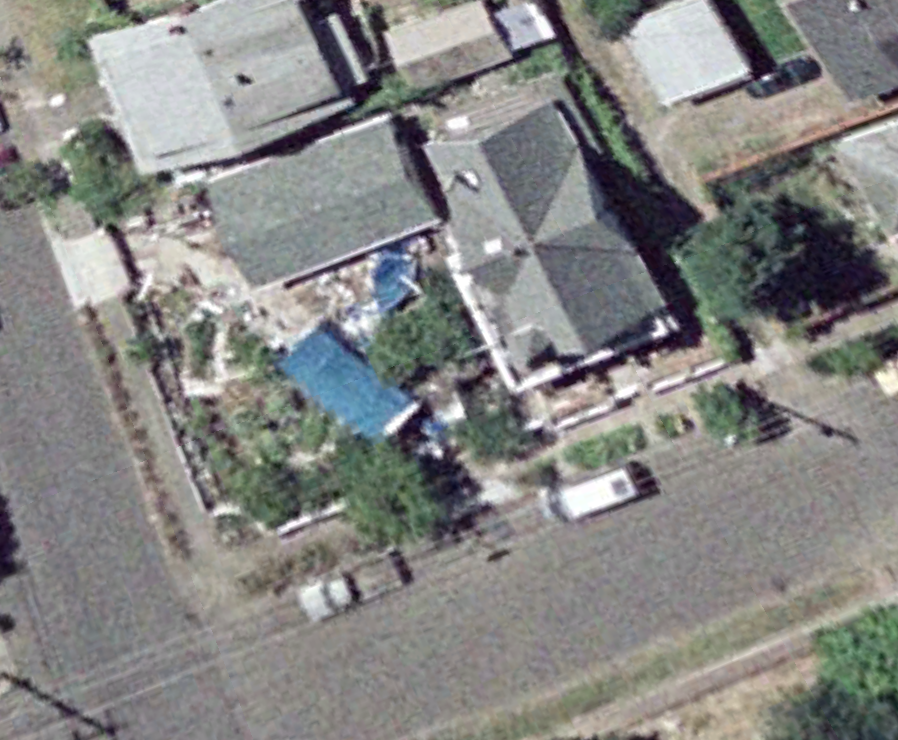 July 2005. Yea, there is some kind of van out there. Maybe is the precursor to the Sprinter. The RV has a blue tarp on it and the vinyl roof on the temporary structure seems to be compromised.