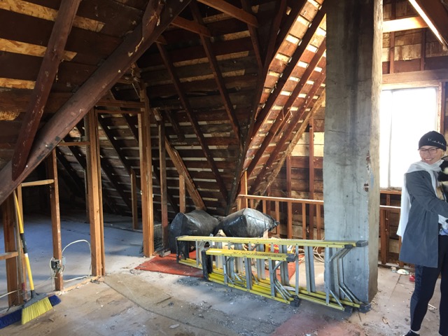The 3rd floor attic is Jenny's favorite space. I suspect this might become a master bedroom suite. Jenny is carrying Ruby around so she doesn't step on a nail and hurt a tootsie.