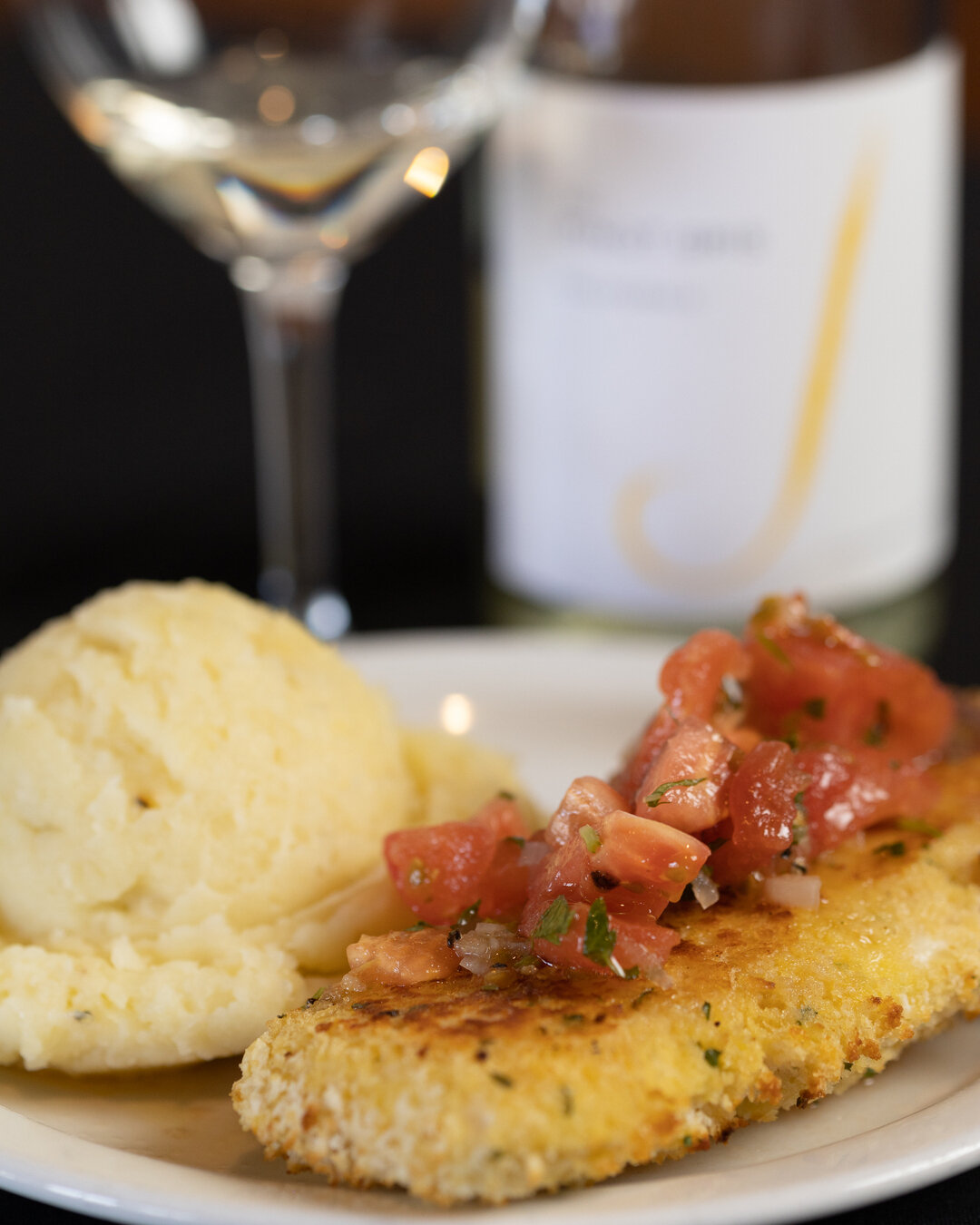 Our Vineyard #Halibut, a Halibut coated with breadcrumbs and served with a tomato &amp; white wine vinaigrette on top. ​​​​​​​​
​​​​​​​​
Reservations at CarversUtah.com​​​​​​​​
#seafood #takeout #dinein #carvers #sandy #Ut #eatlocal #steaksandseafood