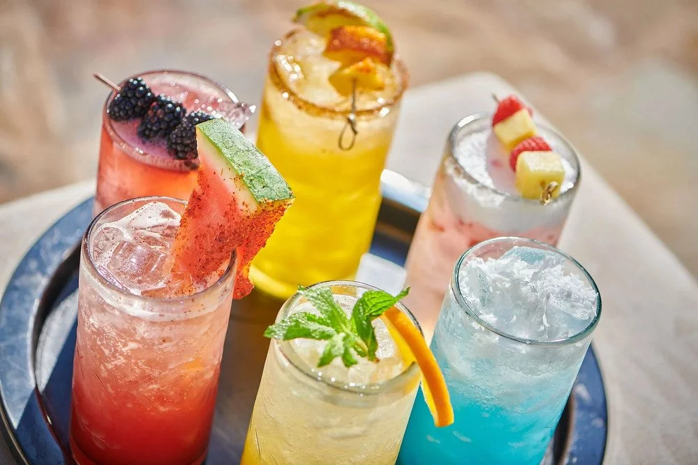 Colorful fruit drinks arranged on a tray