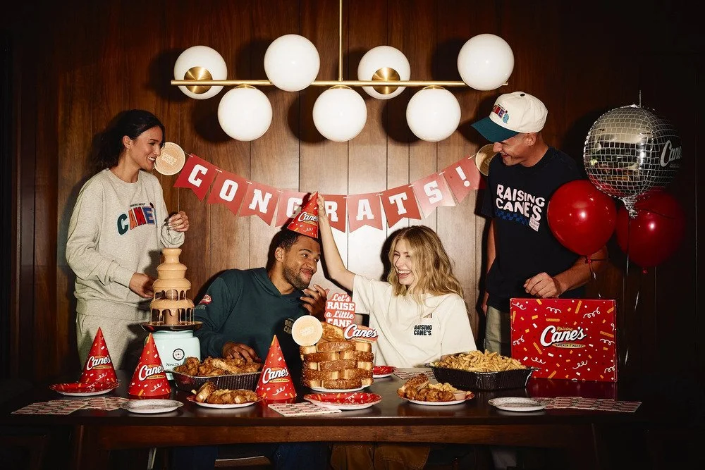 Group posing at a branded restaurant celebration