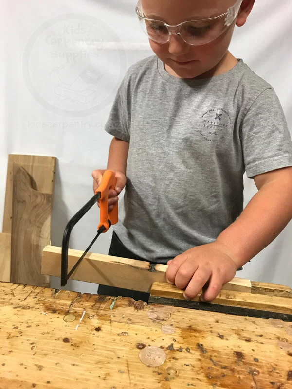 Boy Sawing Wood