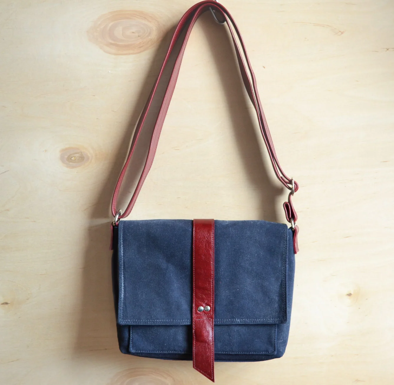 Davy waxed canvas mini messenger bag in Navy