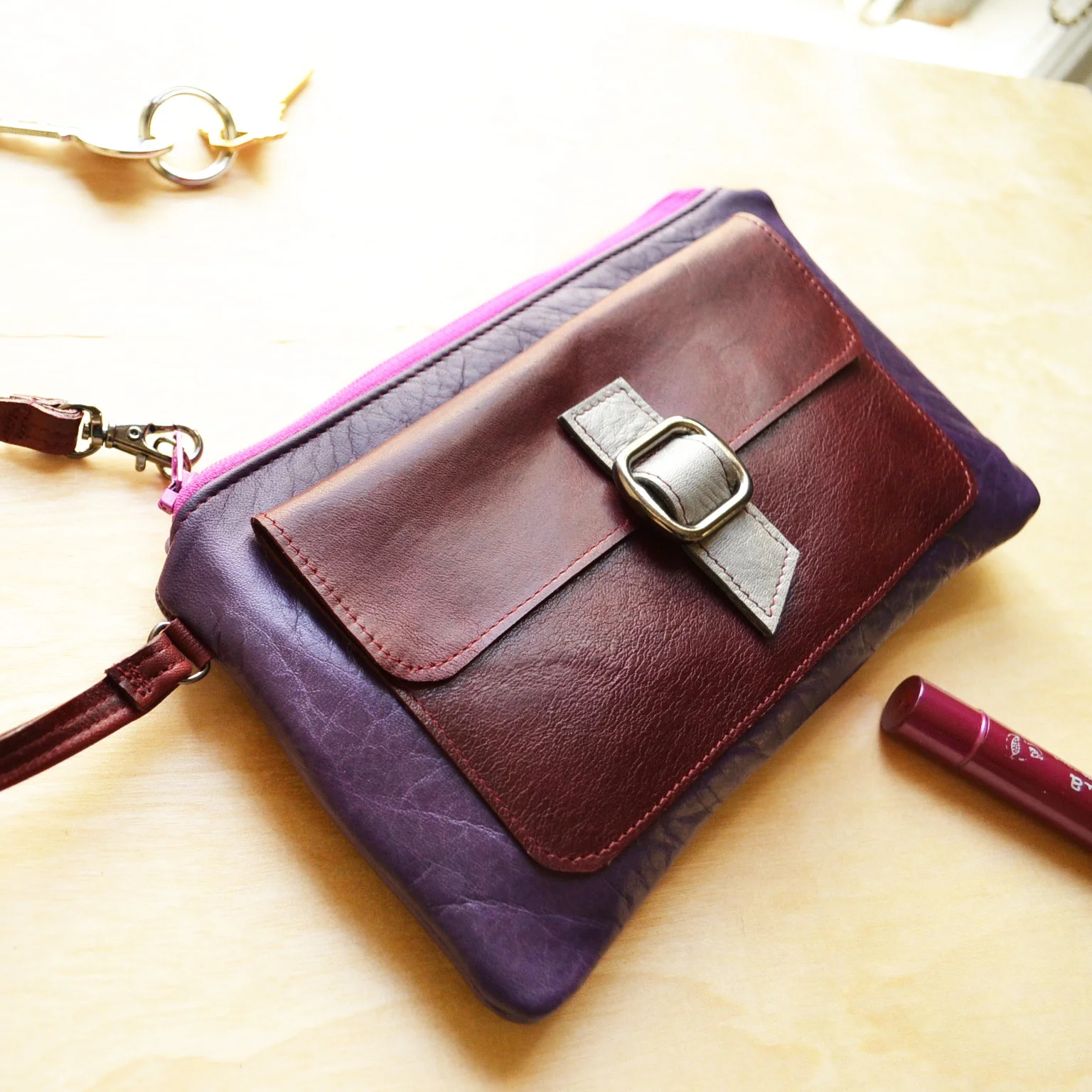 purple wristlet clutch with pocket