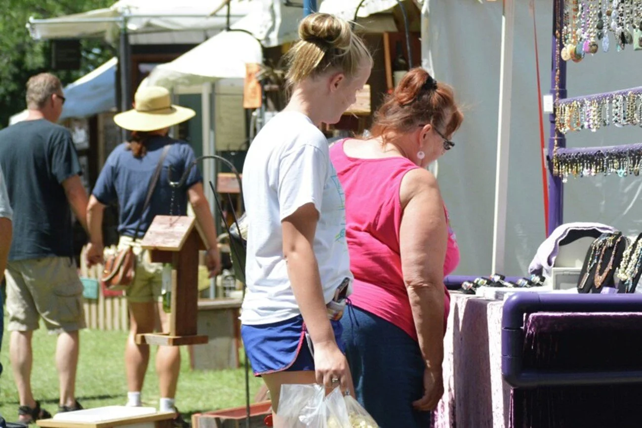 shoppers at an outdoor summer art event