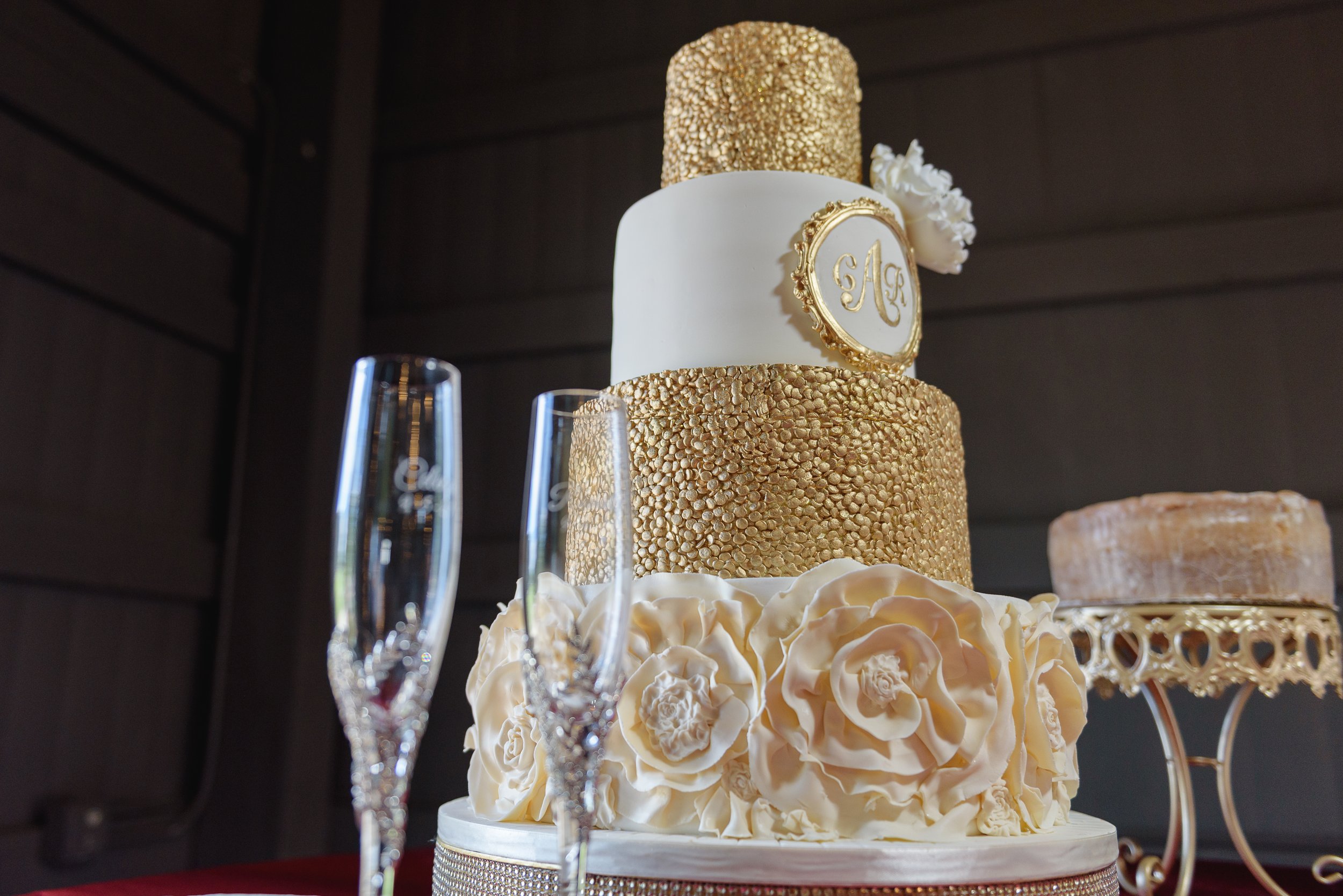 Custom white and gold wedding cake displayed for a wedding day in Georgia