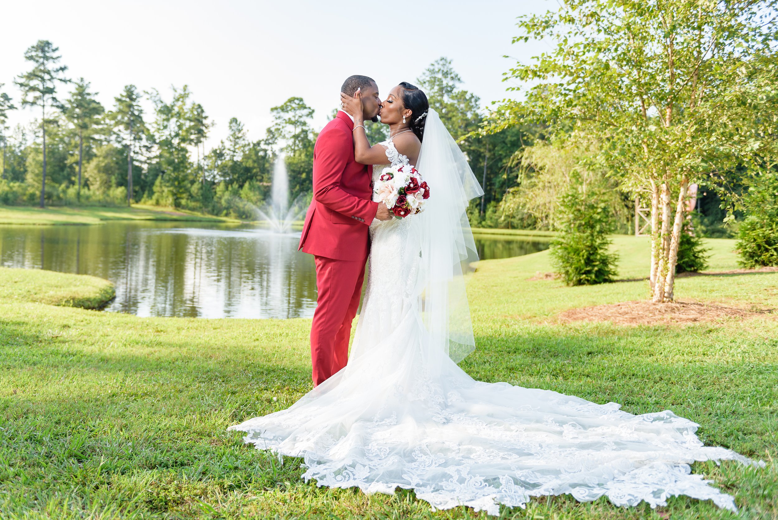 Bride and Groom pose for a photo on wedding day on the grounds of Mystic Acres Wedding Venue in Griffin, Georgia