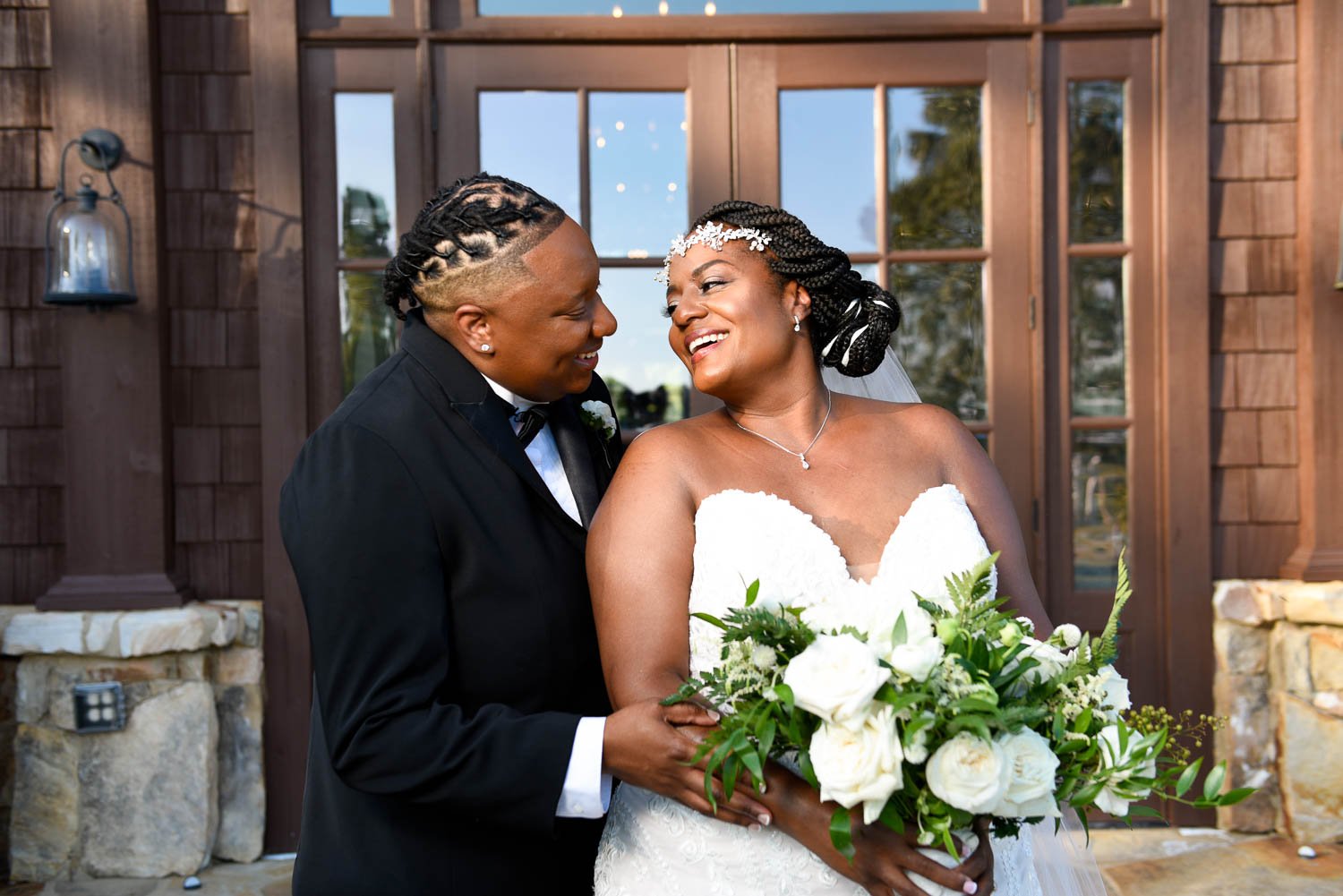 Brides celebrate their love with a kiss during wedding day portraits with B. Rich Photography