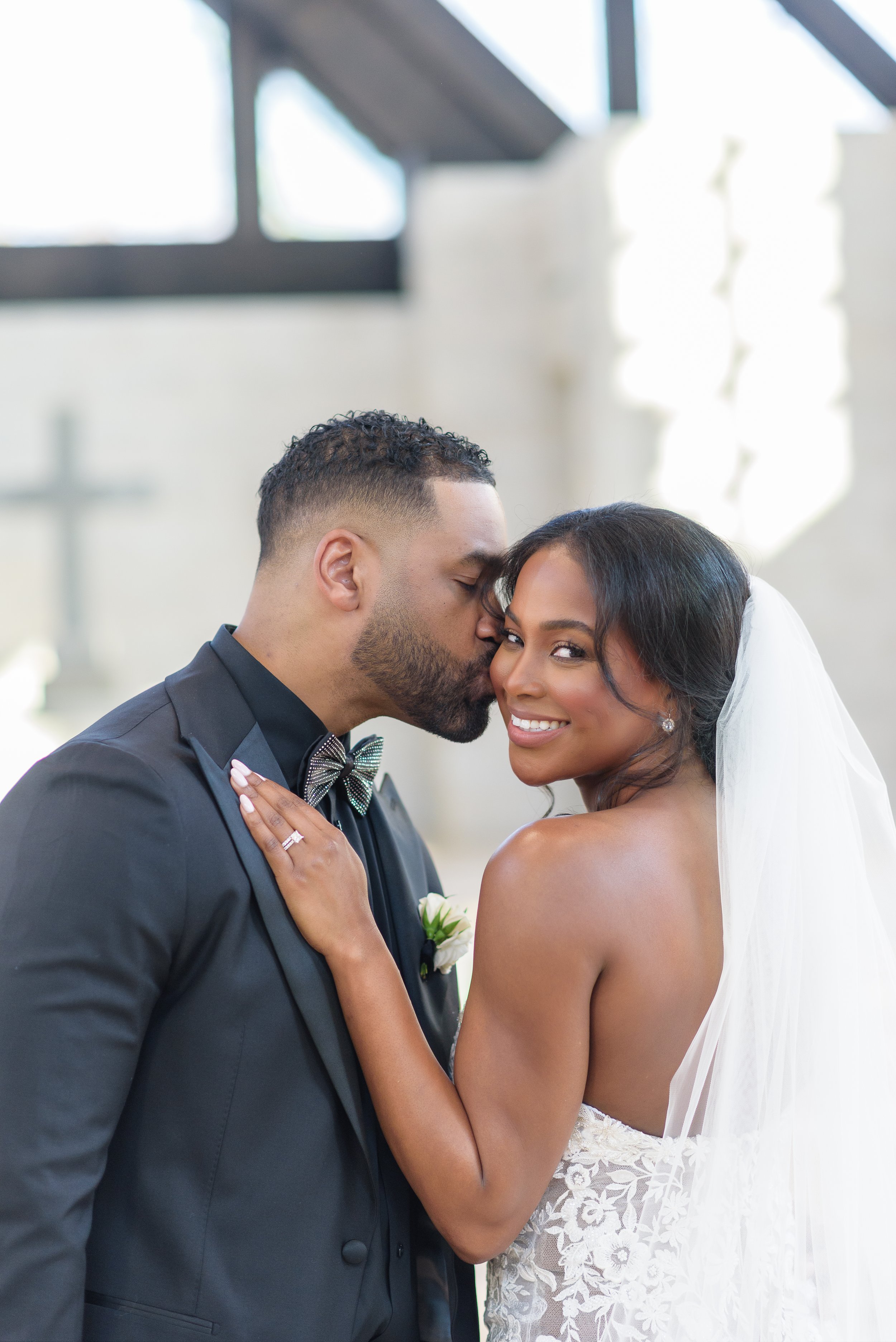 Newly wed bride and groom take photos inside the chapel of The Chapel on McEver Wedding Venue