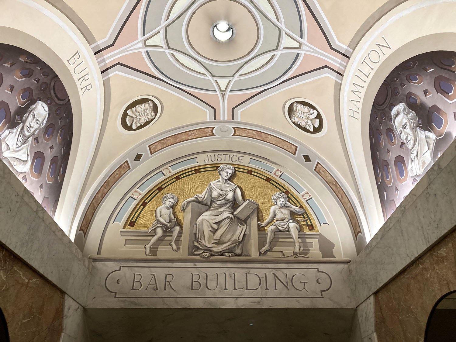    New York City Bar Association Mural  (detail, lunette over entrance to lobby, flanked by painted niches),  1983. Keim paints on plaster. Designed by Richard Haas. 