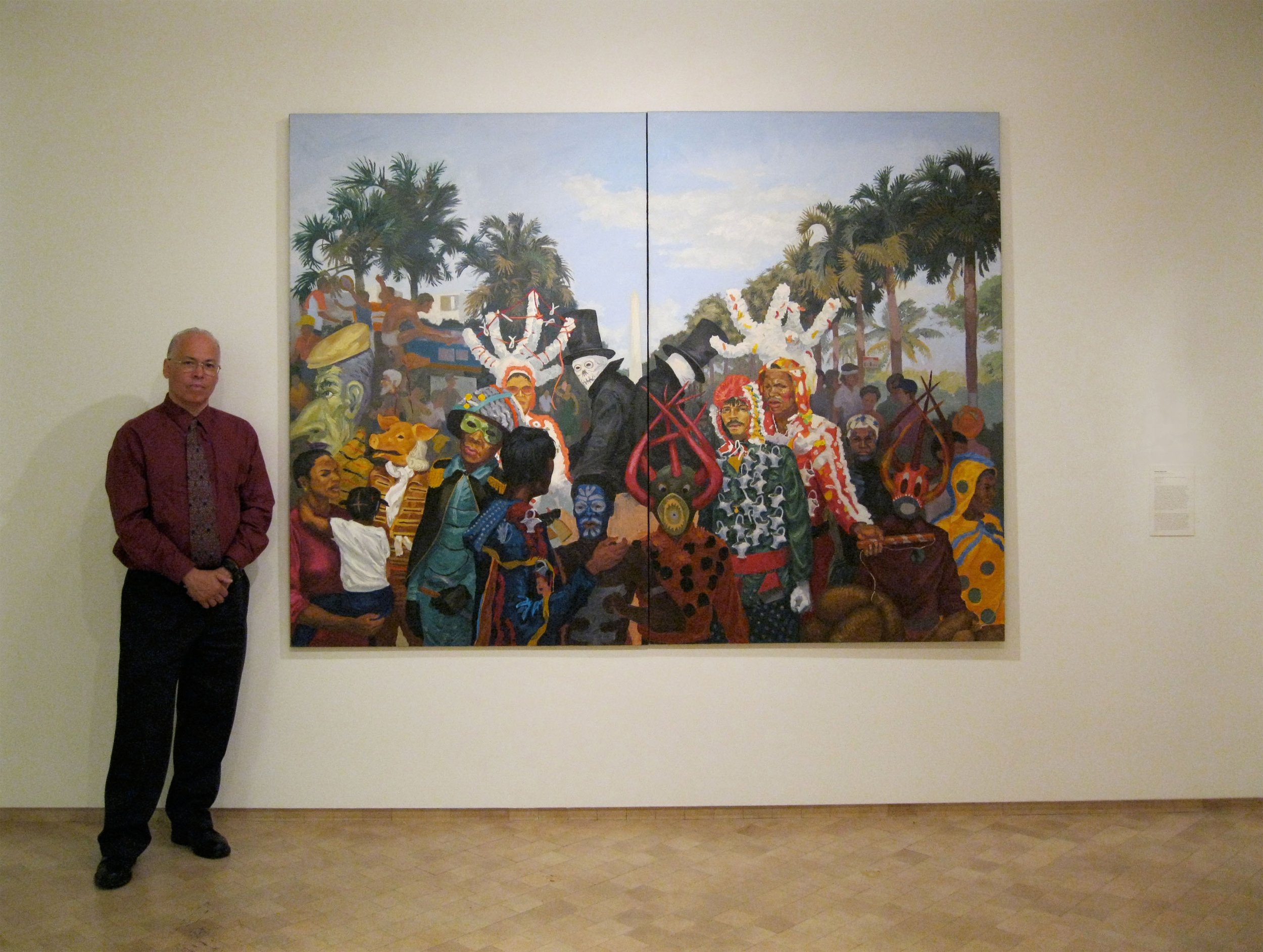  The artist standing with his painting,  Goat Song # 5: Tumult on George Washington Avenue ,&nbsp;1988. Oil on canvas. 72" X 96". Collection of El Museo del Barrio  The artist accepts commissions. All images Copyright: Manuel Alejandro Macarrulla. 