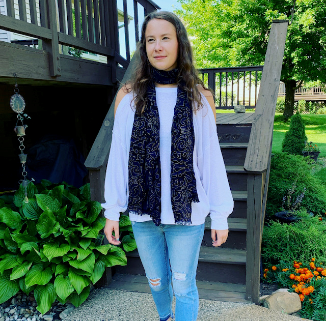 If you want to channel your inner Olivia, you can grab the Free People Chill Out White Top for $68 and pair it with the Sneak Peak Mid Rise Light Jeans for $49. Add any dark-colored scarf you have, and you’ll be set!