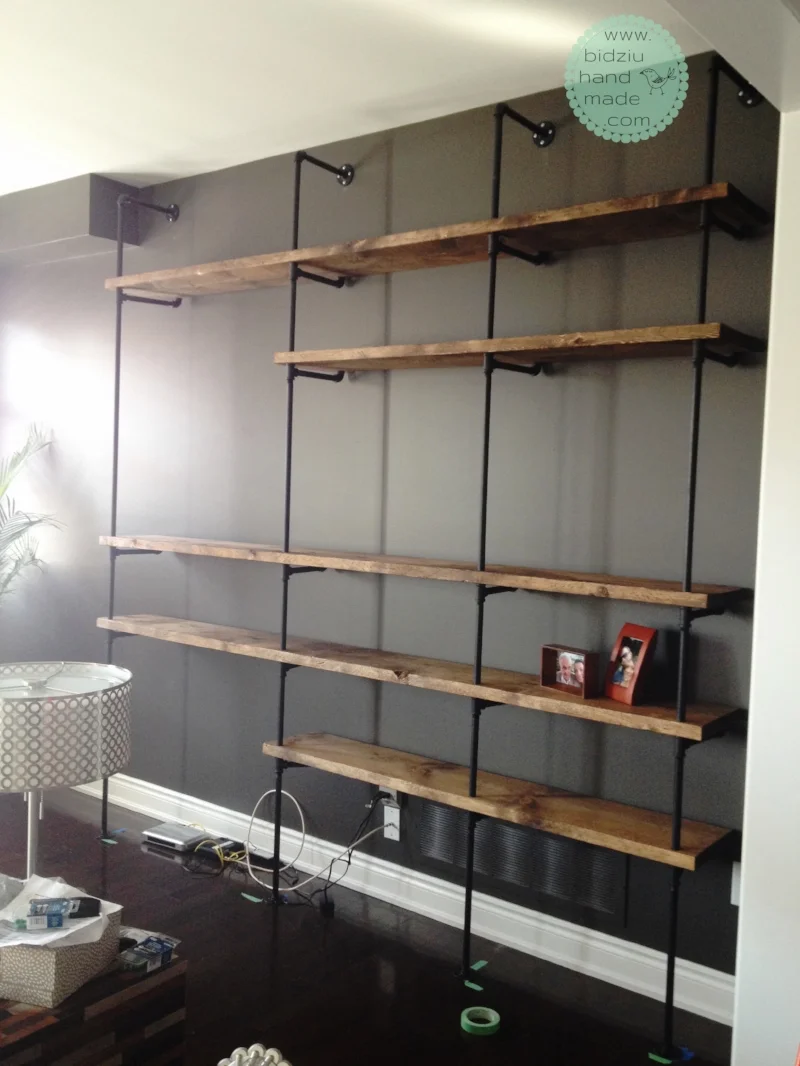 Final result! Industrial pipe shelving unit fully assembled. Last remaining step is to paint the screws on the flanges black to match the piping.