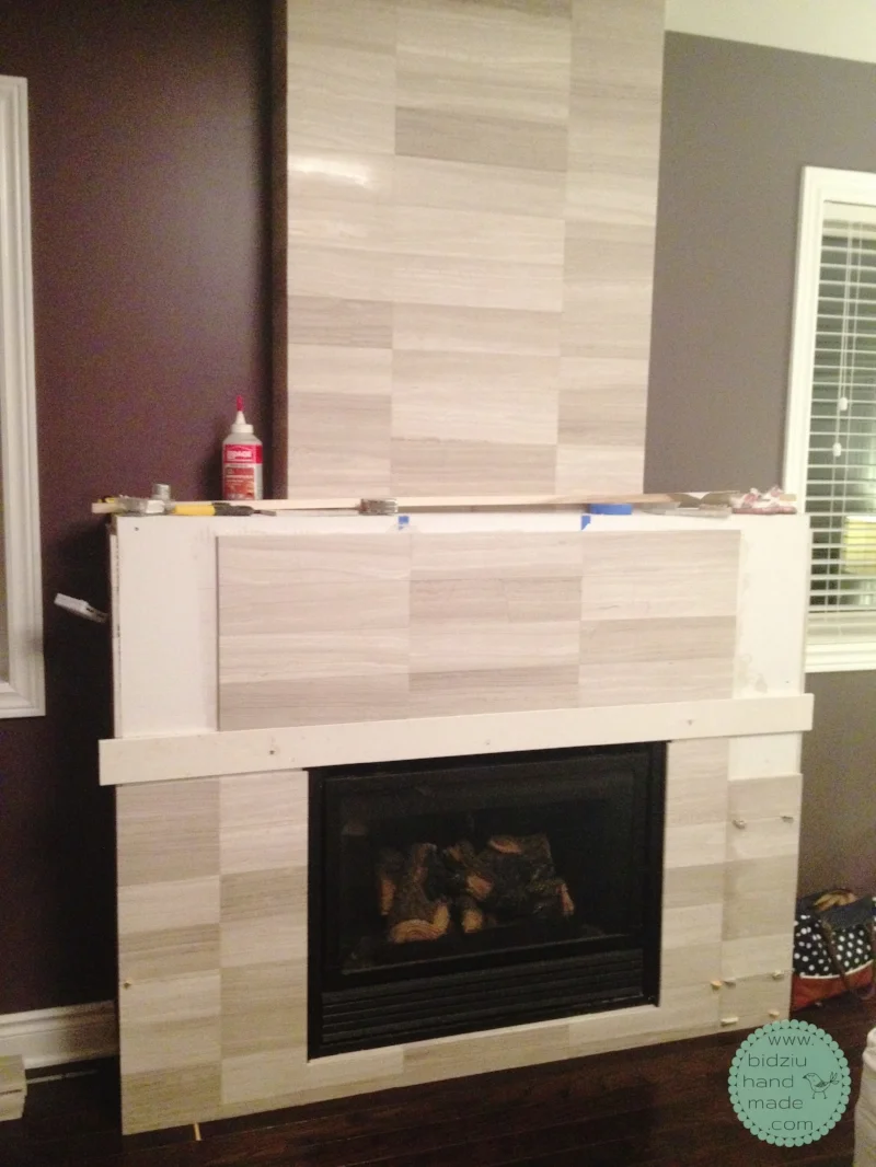DIY fireplace, DIY fireplace facelift, DIY fireplace renovation, DIT marble fireplace, DIY tiled fireplace, DIY modern fireplace, DIY house project, modern fireplace, marble fireplace idea, DIY tall fireplace, fireplace in the bedroom, DIY fireplace reface, refacing a fireplace, DIY home project, DIY home reno, Bryan Baeumler, bidziu handmade, bidziu hand made
