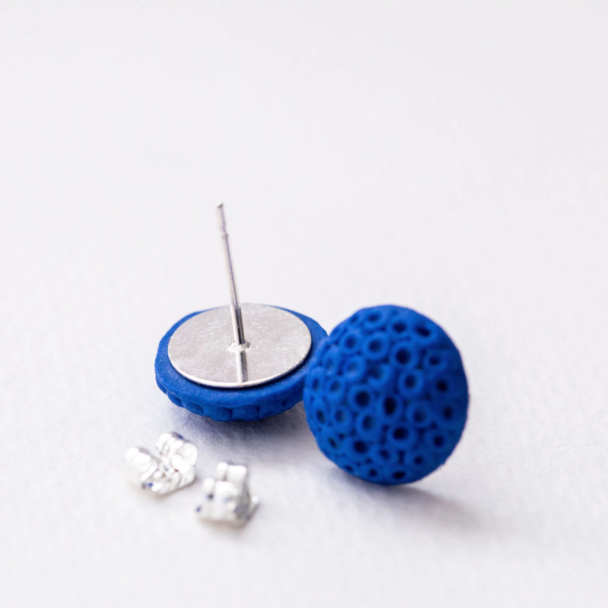 AM PM Ceramics Lapis Lulu behind studs.jpg