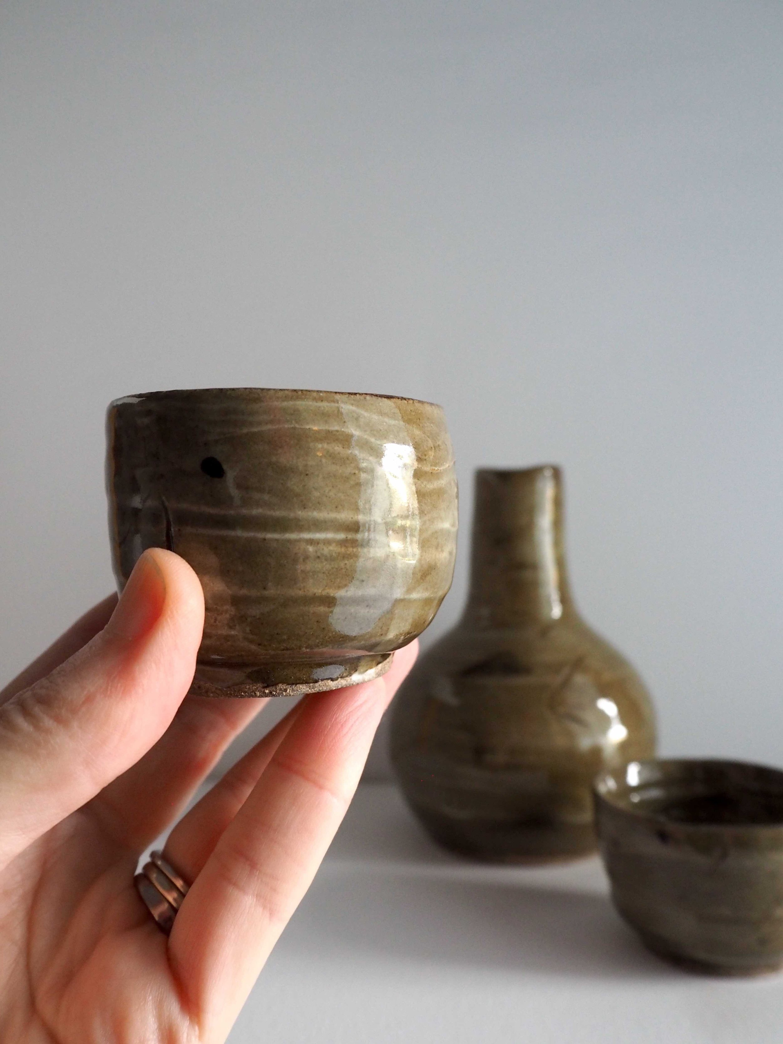 GOST Jacqueline Lewis sake set with cup in hand_low res.jpg