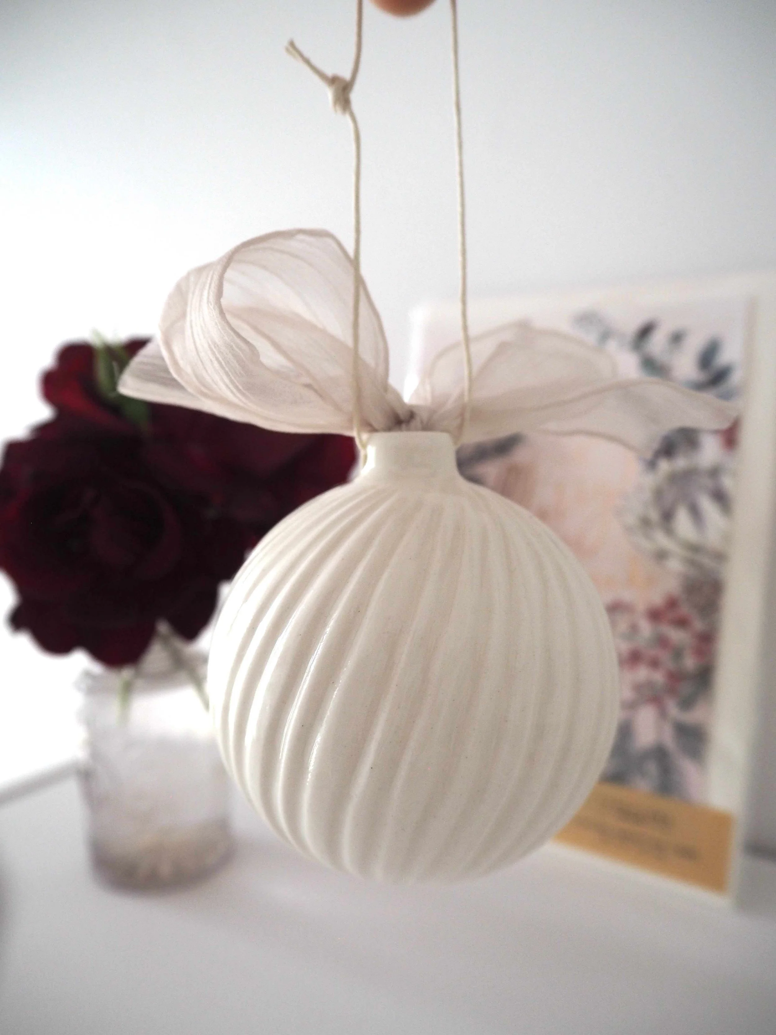 GOST_Lucy Ings_swirls white with pink ribbon_low res.jpeg