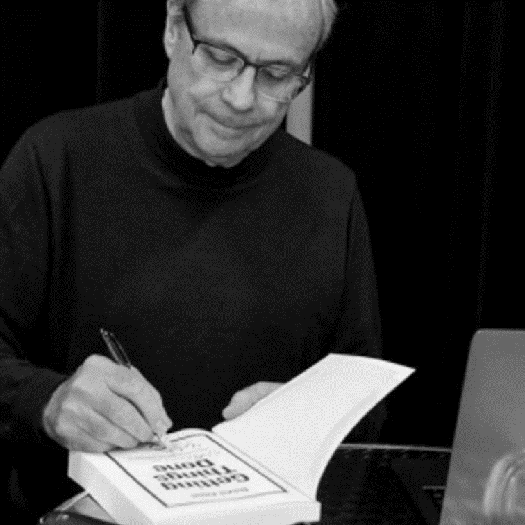 David Allen signing books.png