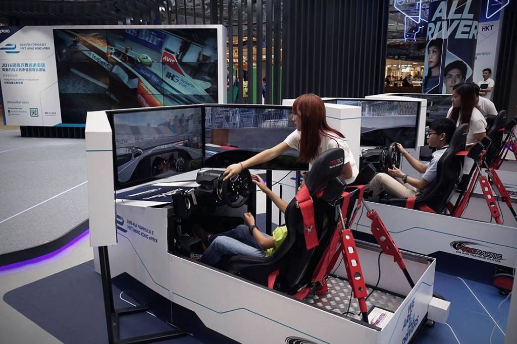 Children enjoy a simulator experience during a roadshow event