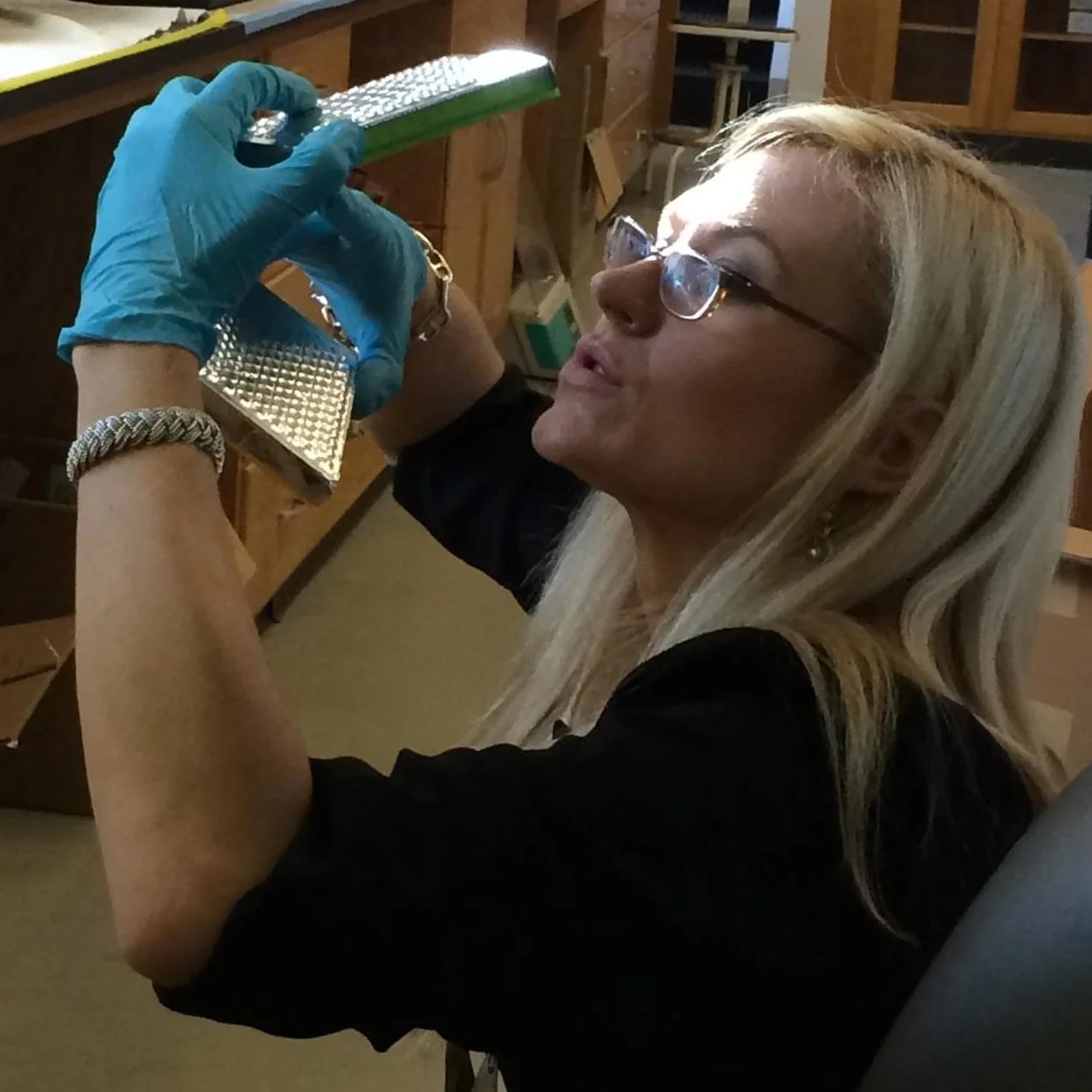 Co-inventor Dr. Anne A. Madden looking at samples in the lab.