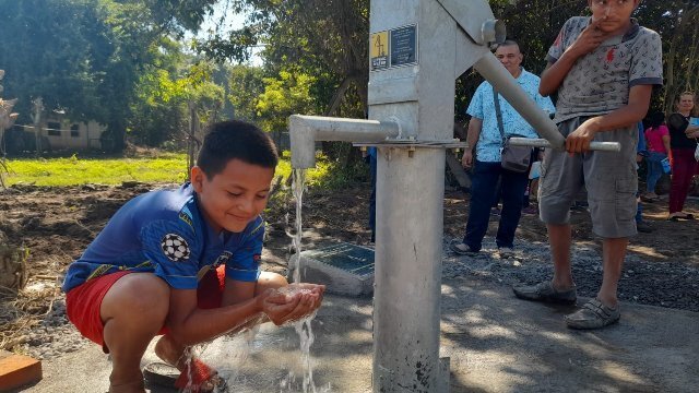 Guatemala Boy Drinking Water.jpg