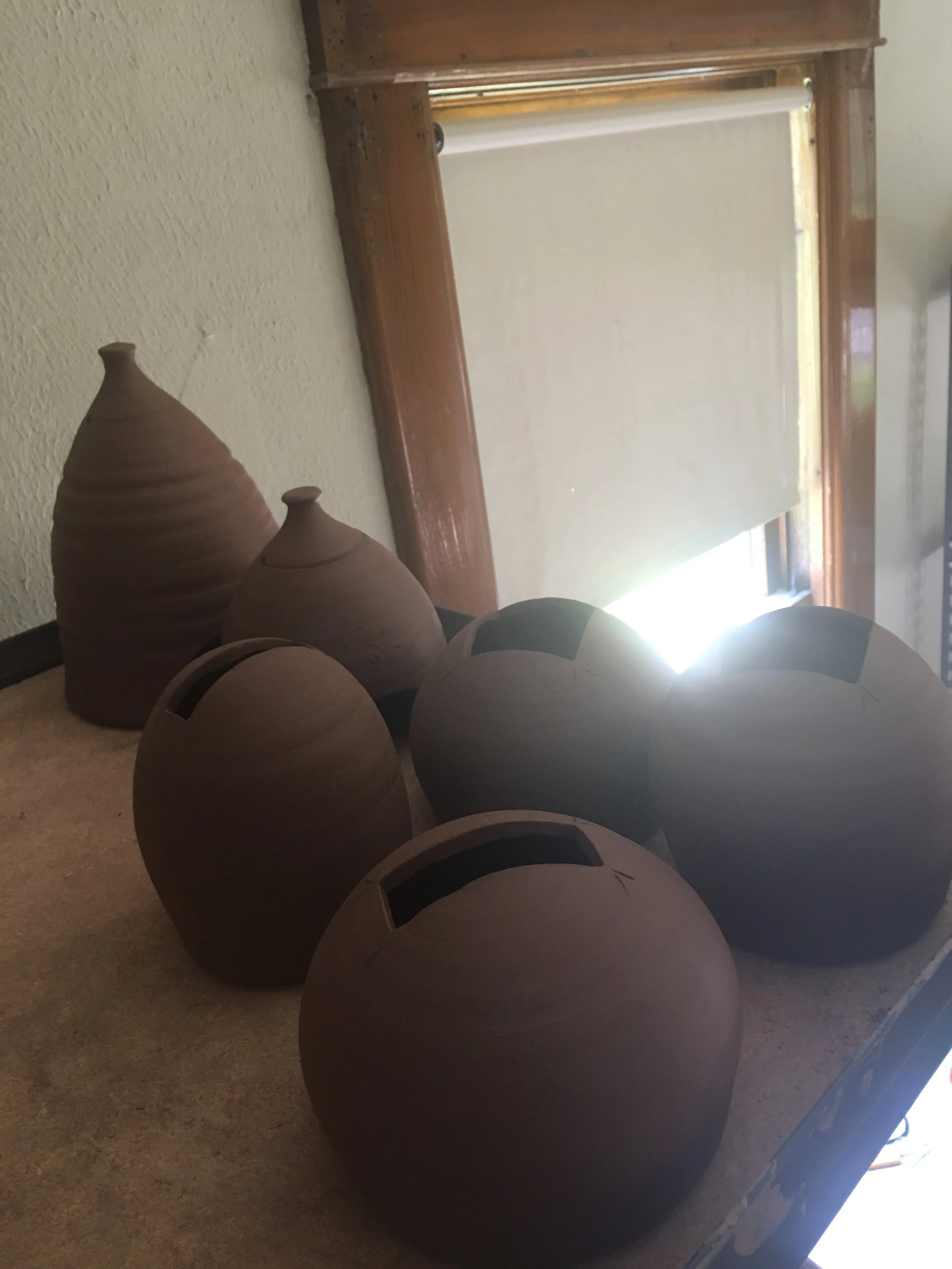 Rounded planters with square opening.