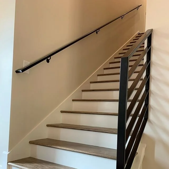 A contemporary horizontal flatbar rail i welded up for a couple in  #beltonsc #riseandrunsc #riseandrunstairworks