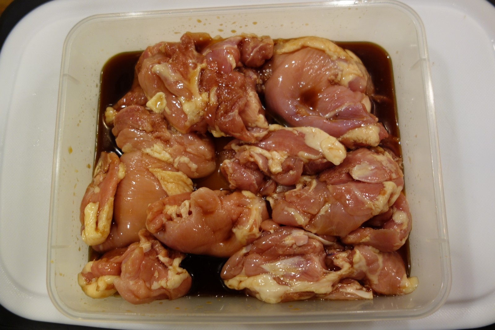 After drying, add Yakitori sauce and toss chicken to ensure even coating.