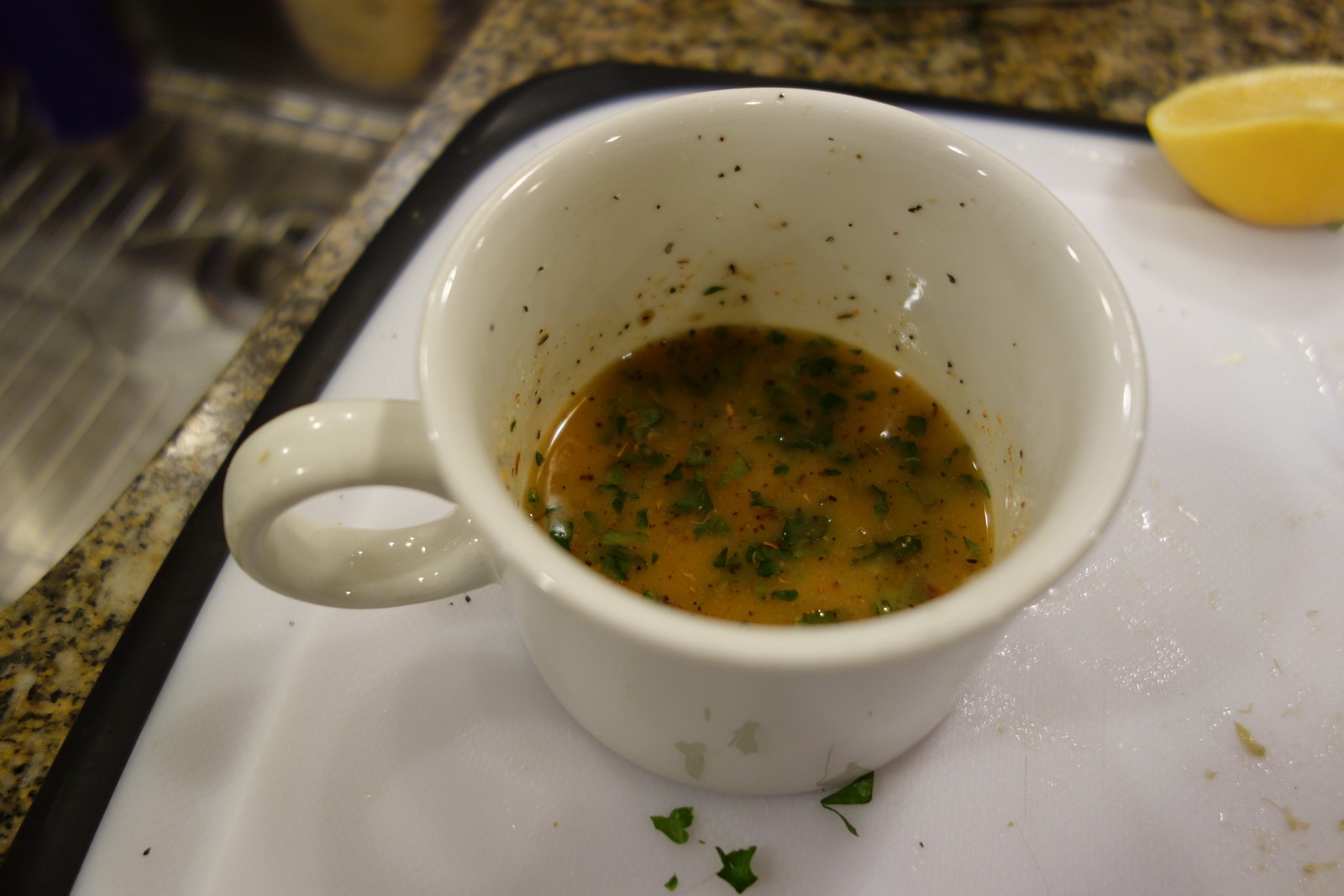 Finished butter sauce. The dark stuff is real parsley leaves - dried leaves can be substituted.