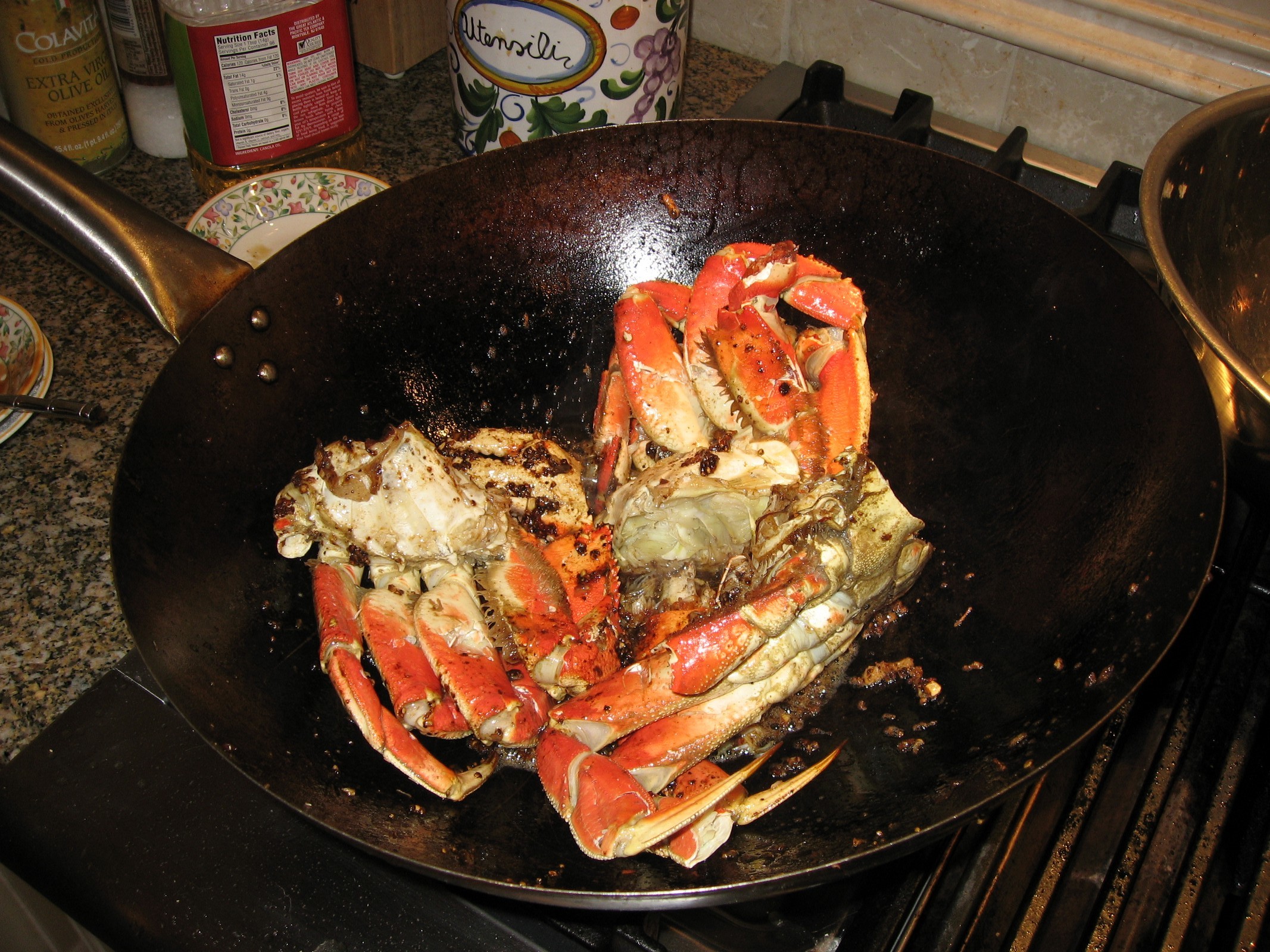 Add the crab to the black pepper sauce. Toss it constantly for several minutes to ensure it is covered in sauce and heated throughout.