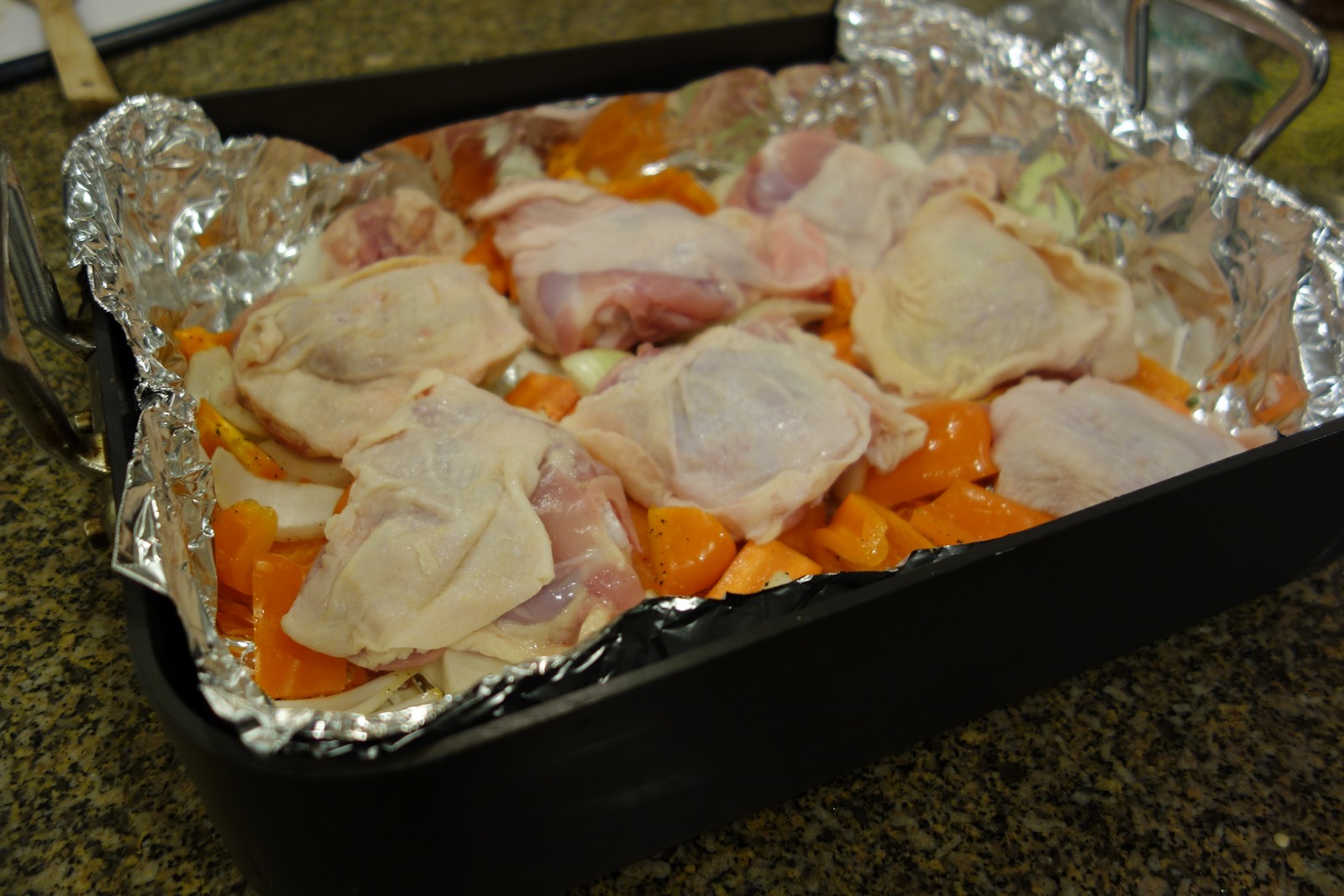 Place the chicken on top of the vegetables.