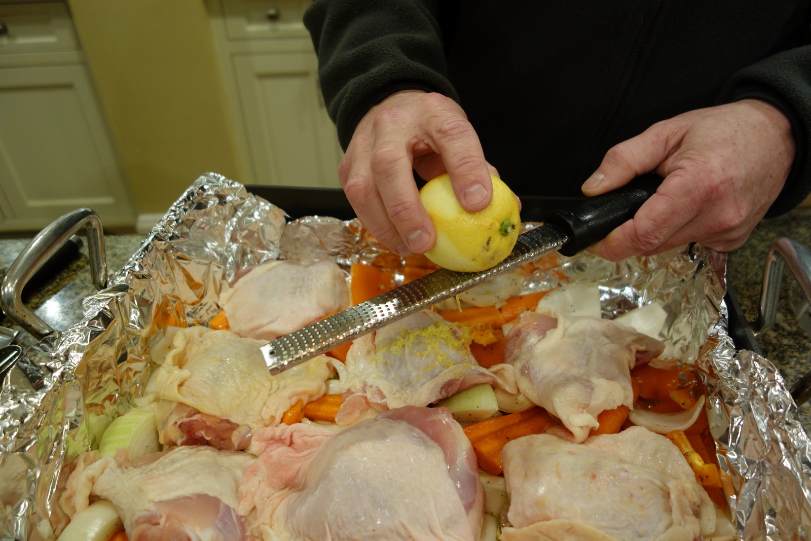 Zest two lemons over the chicken.