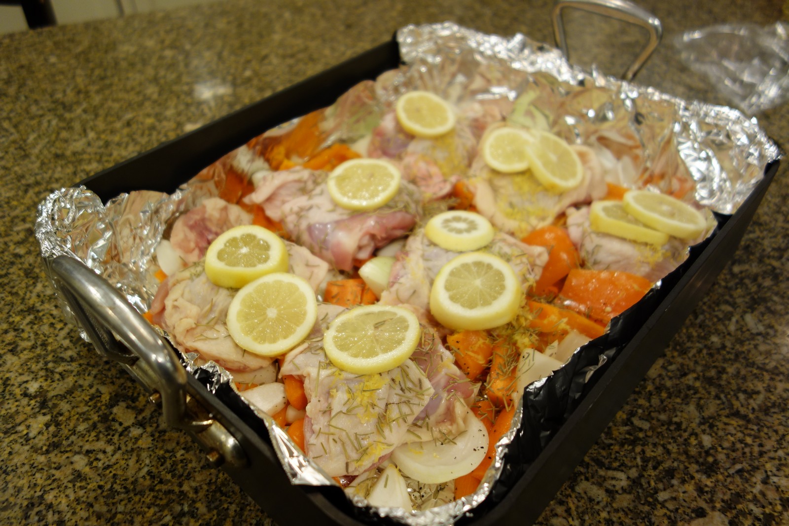 Sprinkle rosemary on top. then squeeze lemons over all of it, and place lemon slices on top.