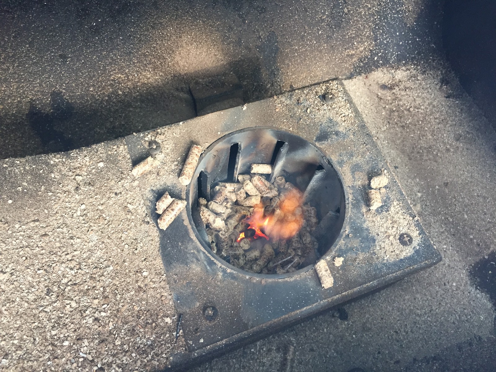 Once the pellets ignite, the flame is varied by feeding more (or fewer) pellets in. The smoker heats up faster than it cools down. You can help it cool down faster by opening the lid.