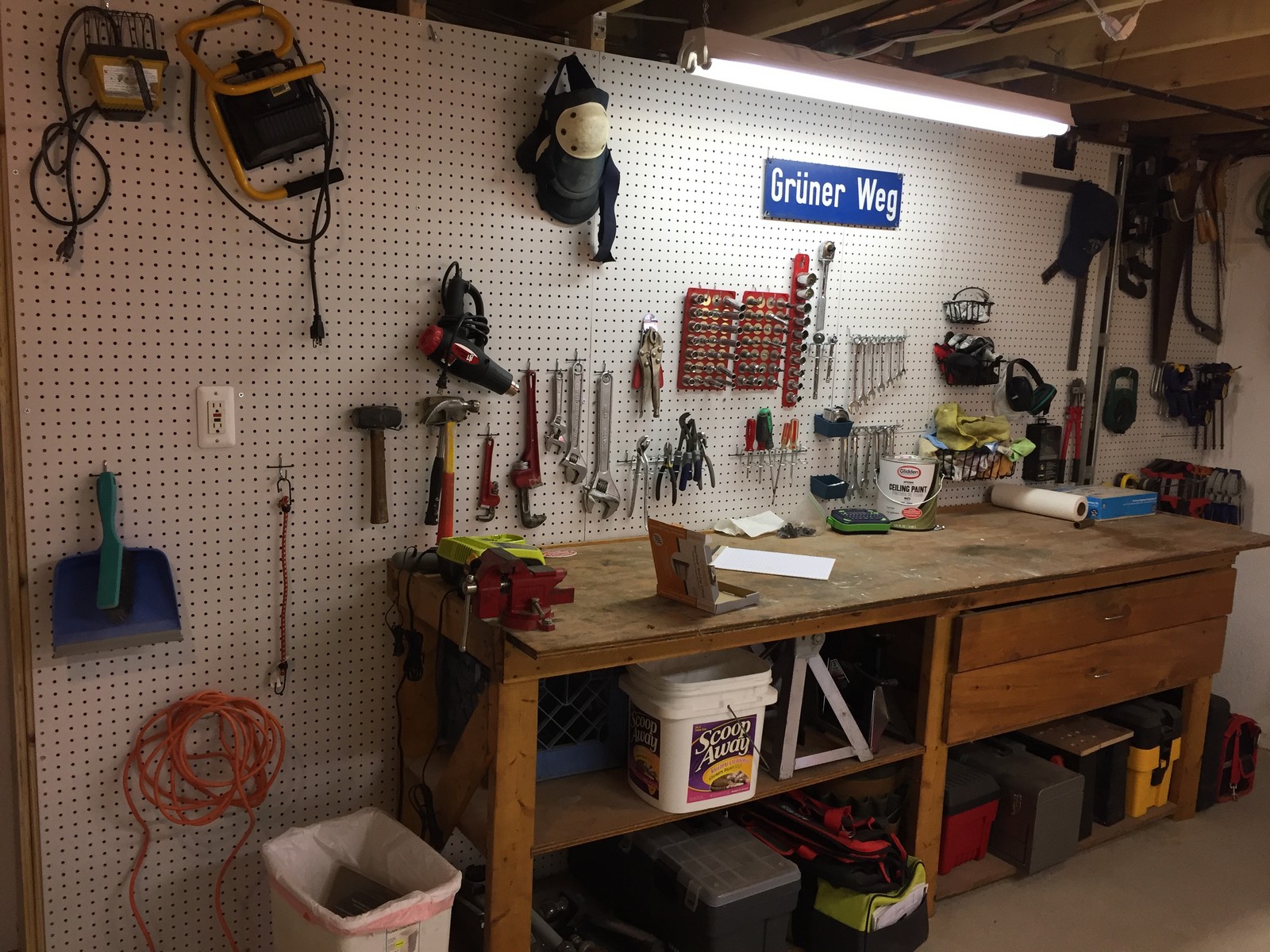 Pegboard wall. Buy the boards and hooks at Home Depot, Lowes, etc.