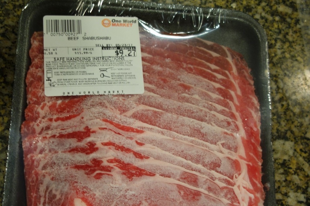 Start with the beef they sell at the Asian market. It's expensive, but is sliced very thin and will be delicious. If you turn into a Shabu Shabu superstar, you can buy your own meat slicer in the future.