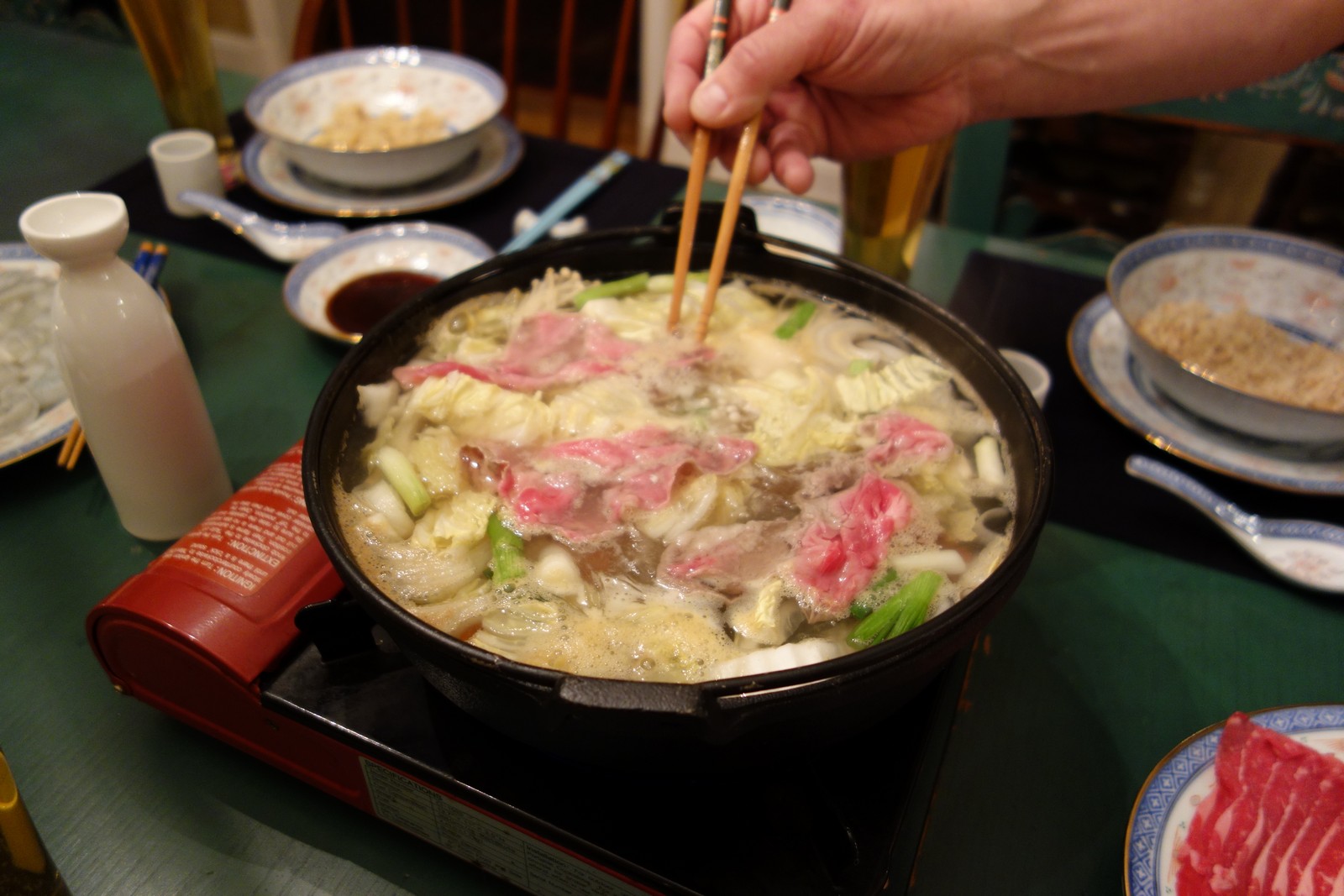 The beef cooks really fast because it is sliced so thin. This makes for a really relaxed pace as you make your way through dinner. If you want more, just put a piece in the pot and it will be done in less than a minute.
